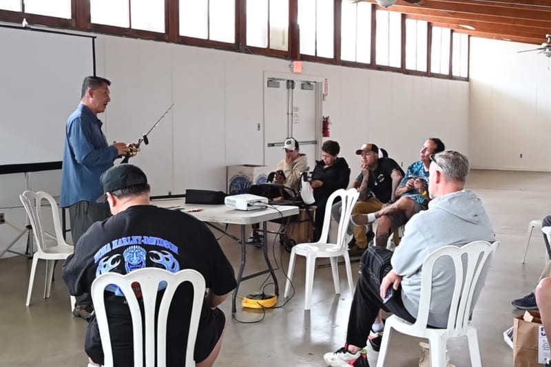 Expert speaker presenting at a fishing seminar